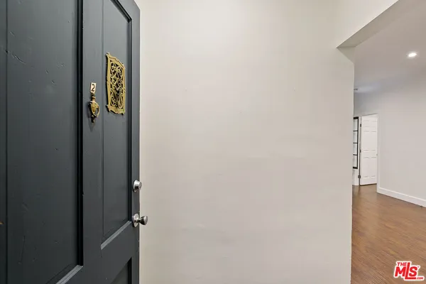 a view of an entryway with wooden floor