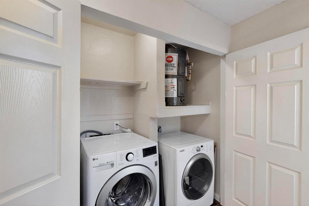 9611 Walnut Street, Unit 1105 Dallas, TX 75081 - Photo 21 of 24 a utility room with dryer and washer
