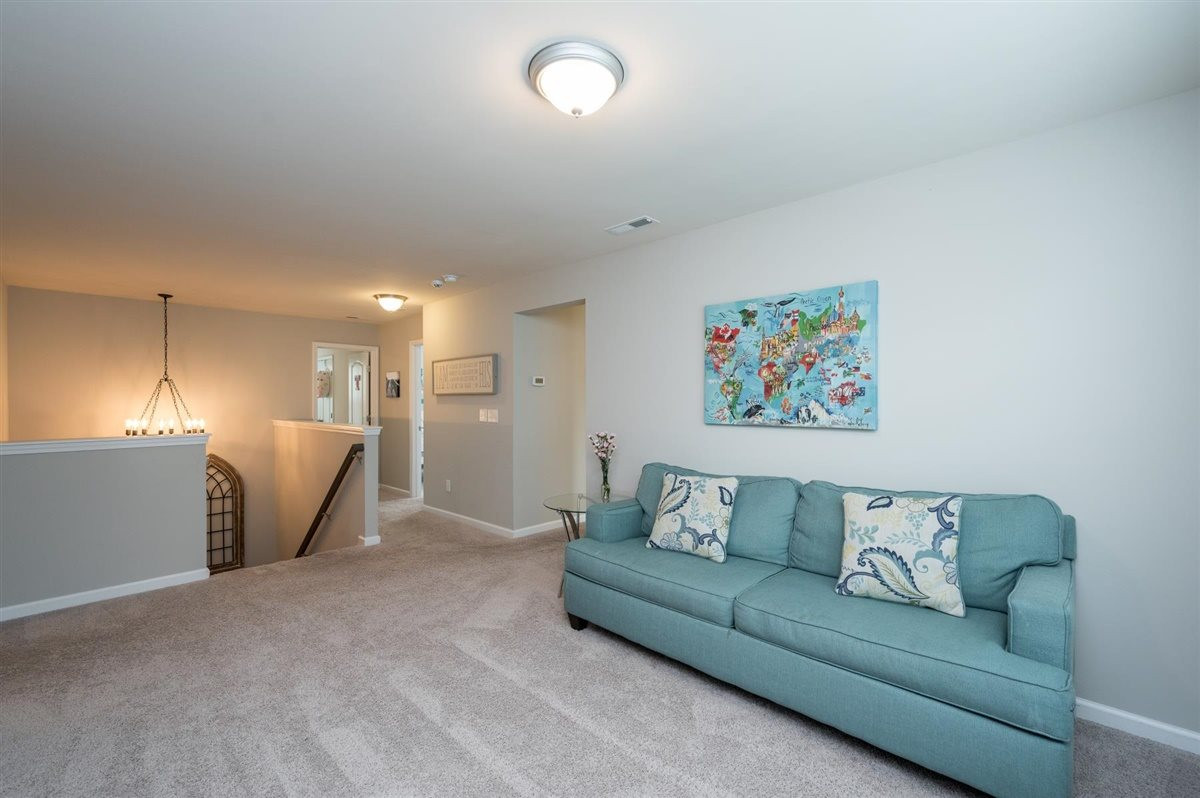 409 Morgan Ridge Road Holly Springs, NC 27540 - Photo 18 of 30 This spacious loft/playroom features custom built-ins and can be used in so many ways Loft