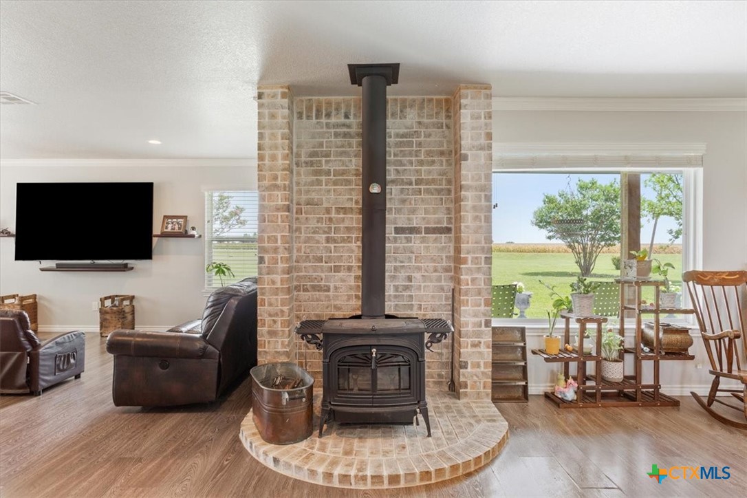 17179 Cyclone Road Burlington, TX 76519 - Photo 11 of 39 a living room with furniture and a flat screen tv