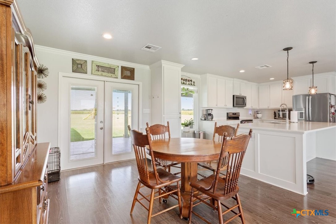 17179 Cyclone Road Burlington, TX 76519 - Photo 12 of 39 a view of a dining room with furniture window and wooden floor