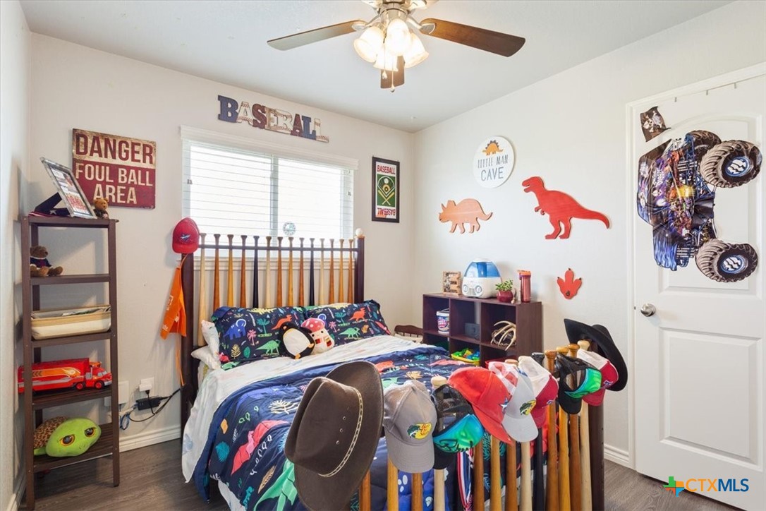 17179 Cyclone Road Burlington, TX 76519 - Photo 22 of 39 a bedroom with furniture a baby crib and a window