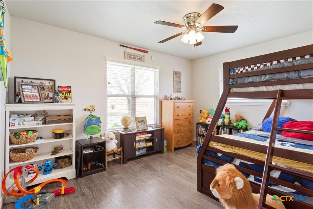 17179 Cyclone Road Burlington, TX 76519 - Photo 23 of 39 a bedroom with two beds and a window