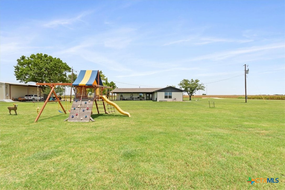 17179 Cyclone Road Burlington, TX 76519 - Photo 26 of 39 a view of an house with swimming pool and porch