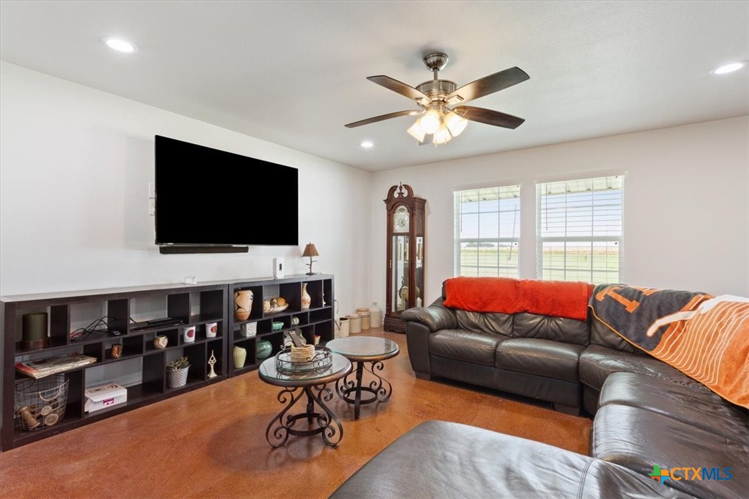 17179 Cyclone Road Burlington, TX 76519 - Photo 29 of 39 a living room with furniture and a flat screen tv