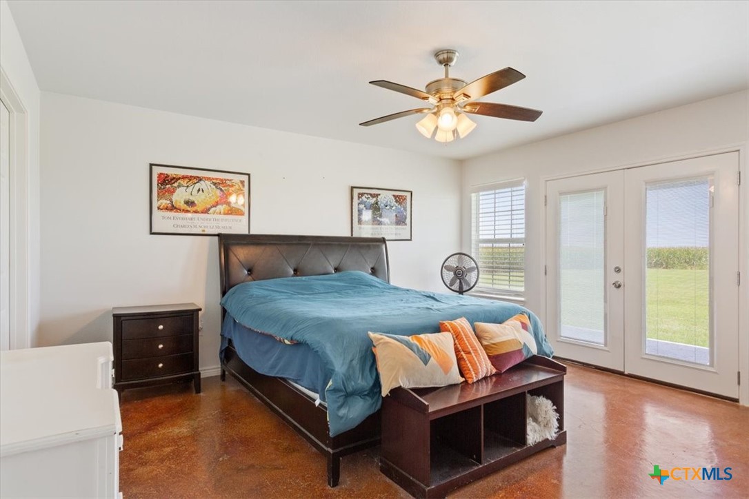 17179 Cyclone Road Burlington, TX 76519 - Photo 32 of 39 a bedroom with a bed and window