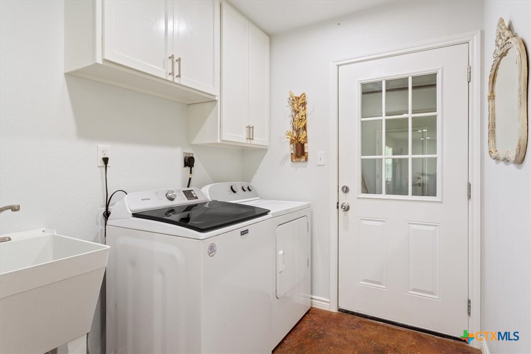 17179 Cyclone Road Burlington, TX 76519 - Photo 36 of 39 a kitchen with a sink and cabinets