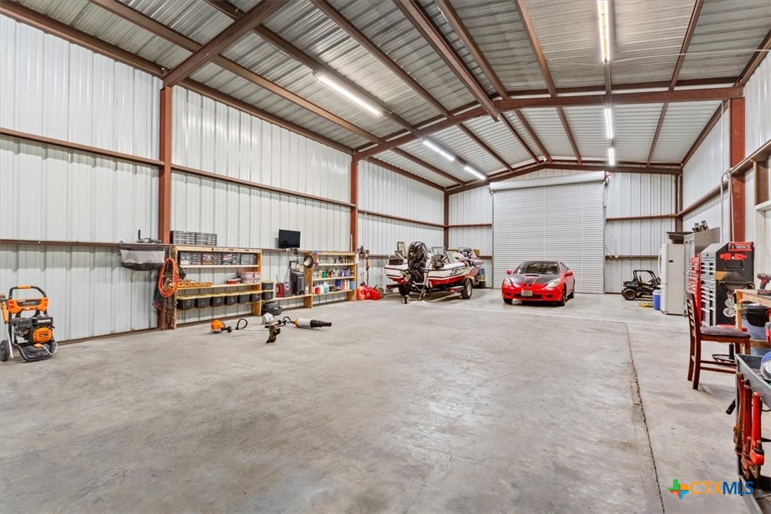 17179 Cyclone Road Burlington, TX 76519 - Photo 38 of 39 a view of parking garage with cars