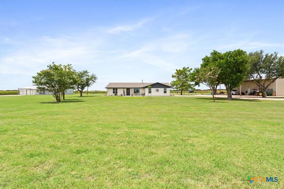 17179 Cyclone Road Burlington, TX 76519 - Photo 4 of 39 a view of a green field with lots of trees in front of it