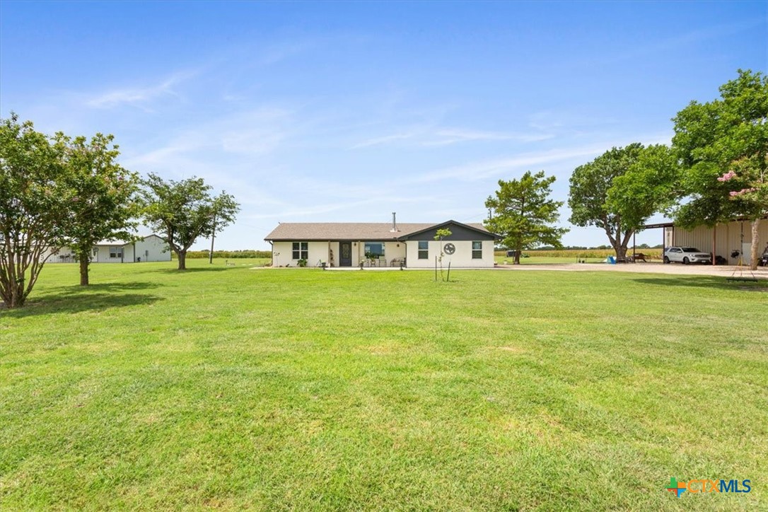 17179 Cyclone Road Burlington, TX 76519 - Photo 6 of 39 a house view with a garden space