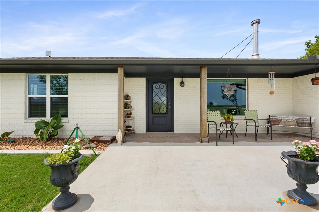 17179 Cyclone Road Burlington, TX 76519 - Photo 8 of 39 a front view of a house with outdoor seating
