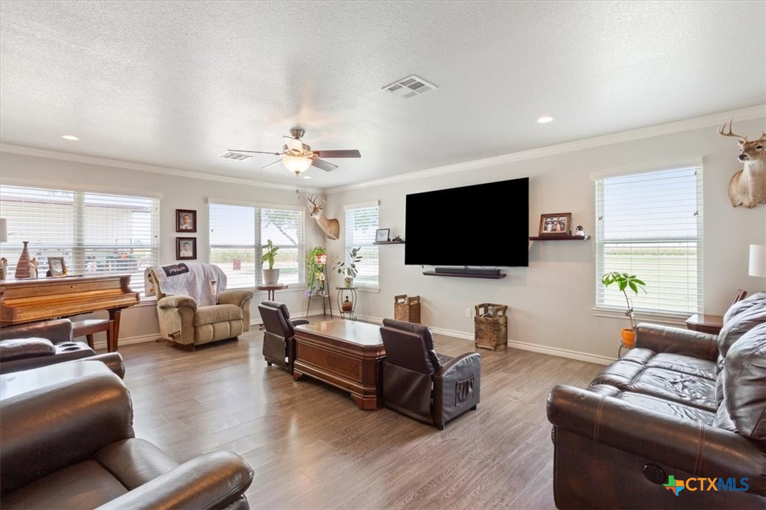 17179 Cyclone Road Burlington, TX 76519 - Photo 9 of 39 a living room with furniture and a flat screen tv