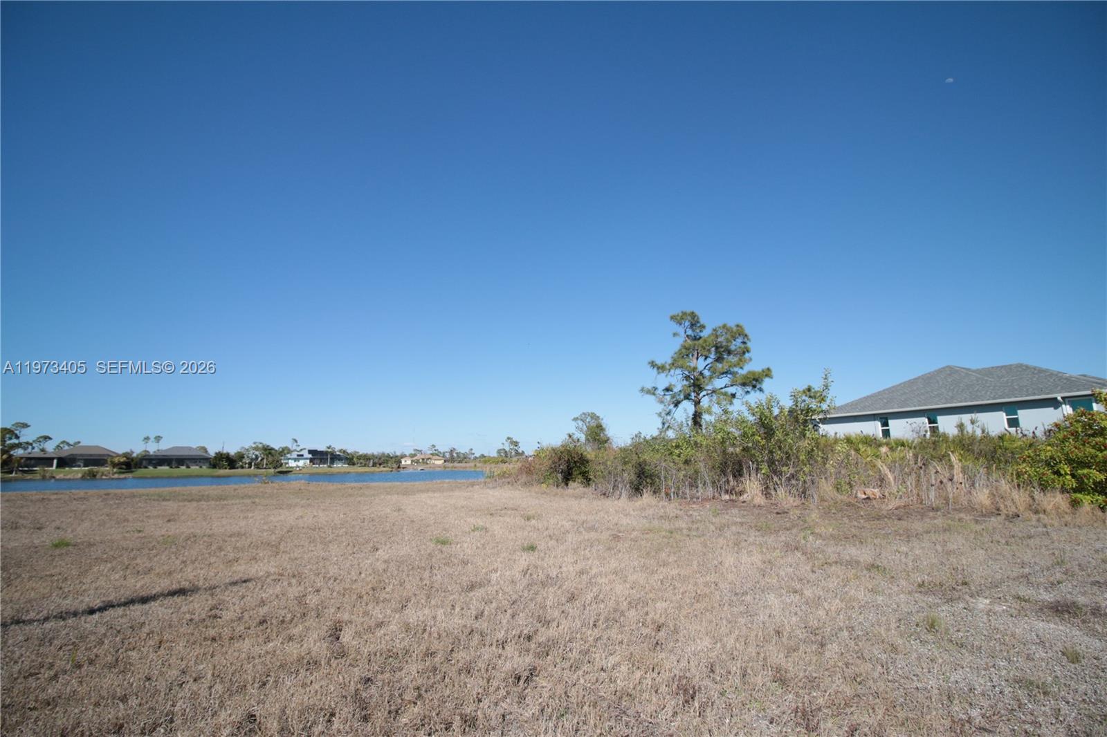 28 Harness Road Placida, FL 33946 - Photo 16 of 22 a view of a lake with a mountain in the background