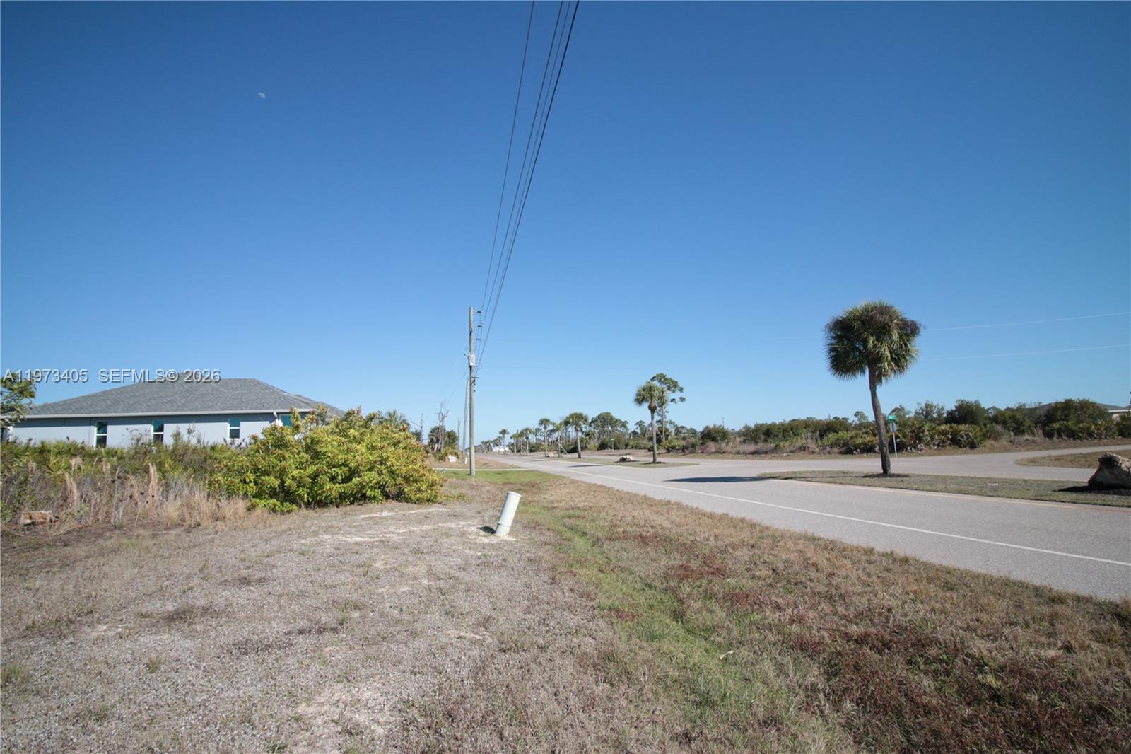 28 Harness Road Placida, FL 33946 - Photo 18 of 22 a view of a street with a large barn