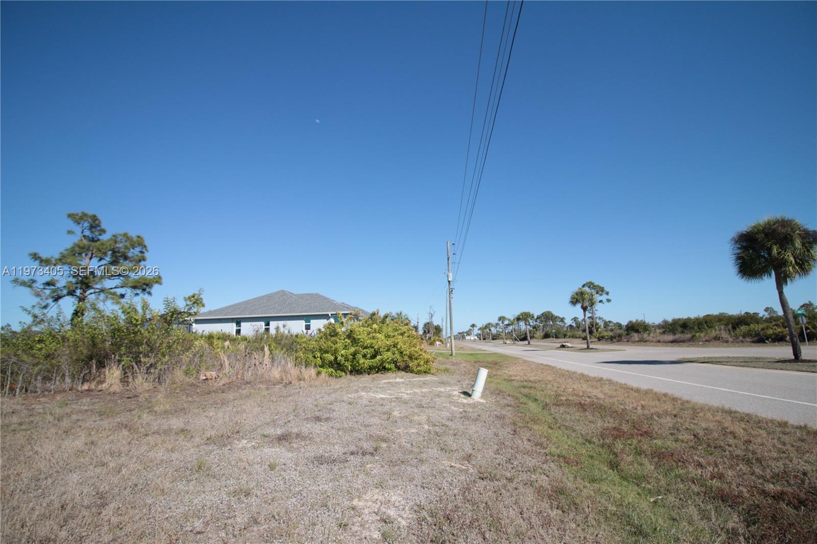 28 Harness Road Placida, FL 33946 - Photo 21 of 22 a view of a backyard and chairs