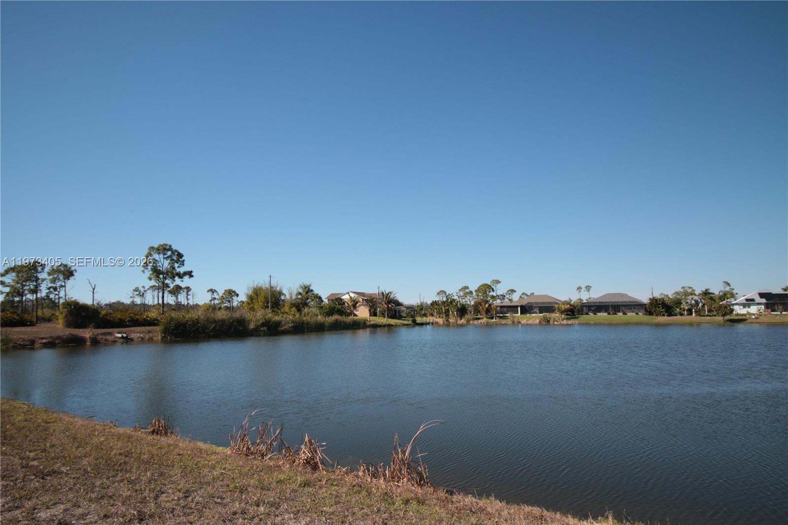 28 Harness Road Placida, FL 33946 - Photo 6 of 22 a view of a lake with houses