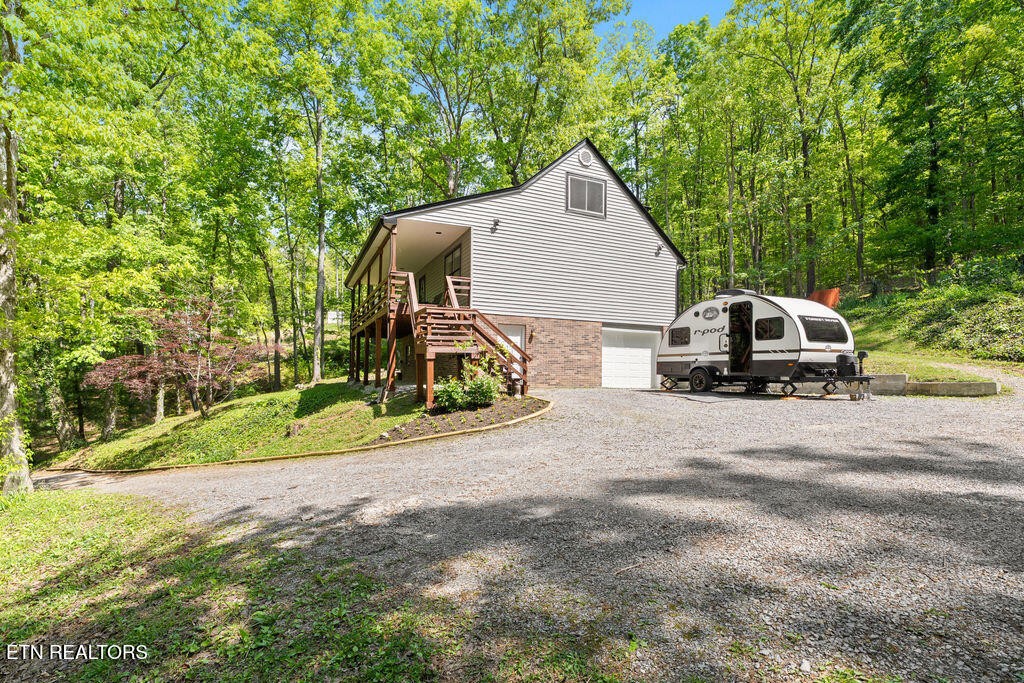 8908 Ellis Lane Powell, TN 37849 - Photo 7 of 37 a view of a parked cars in front of a house