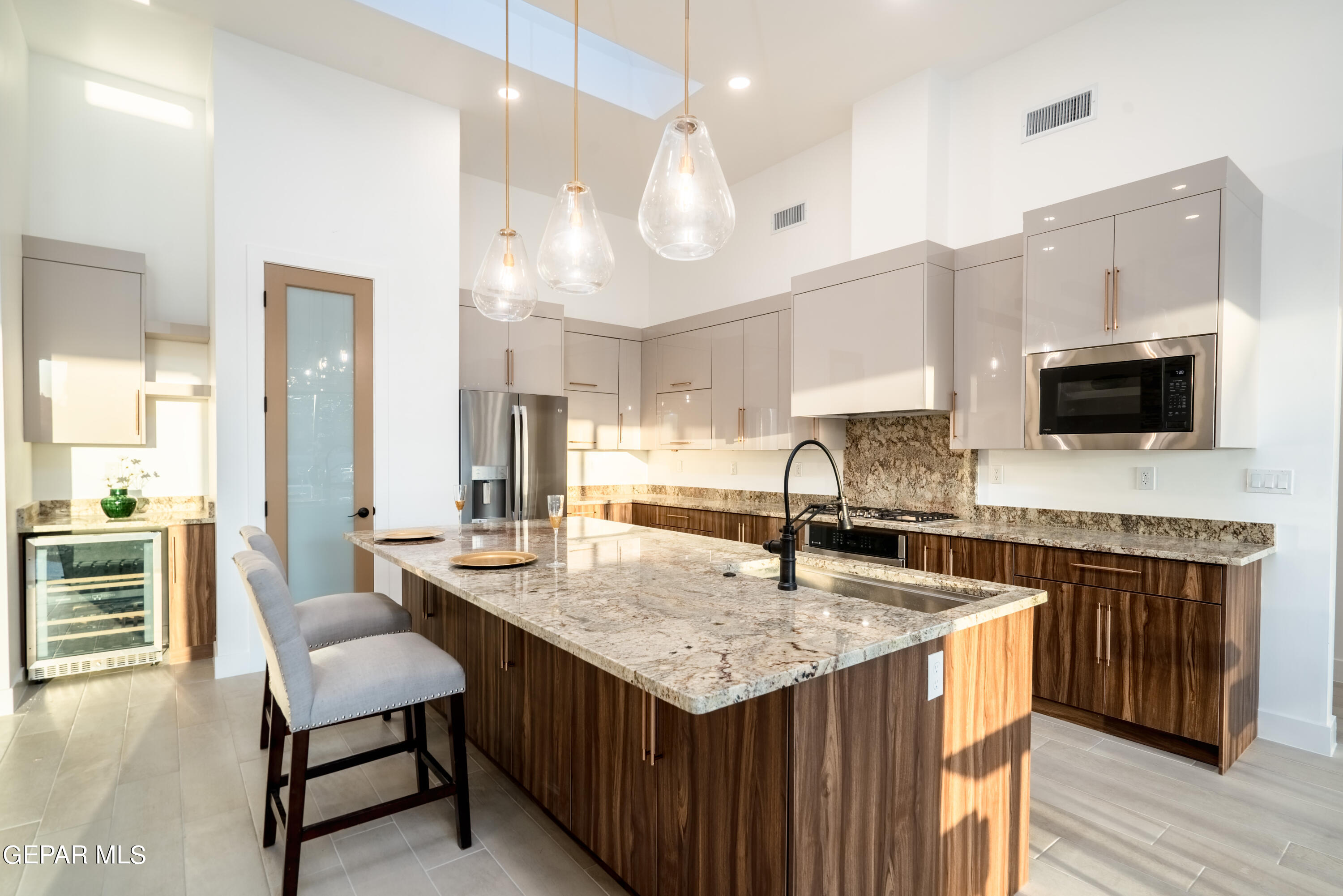 5692 Rio Bonito Circle El Paso, TX 79932 - Photo 15 of 46 a kitchen with granite countertop a sink a counter top space appliances and cabinets