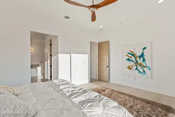 a bedroom with a bed and a couch