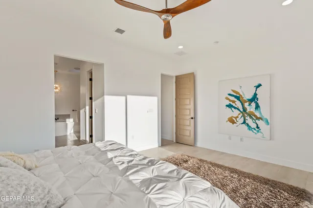 a bedroom with a bed and a couch