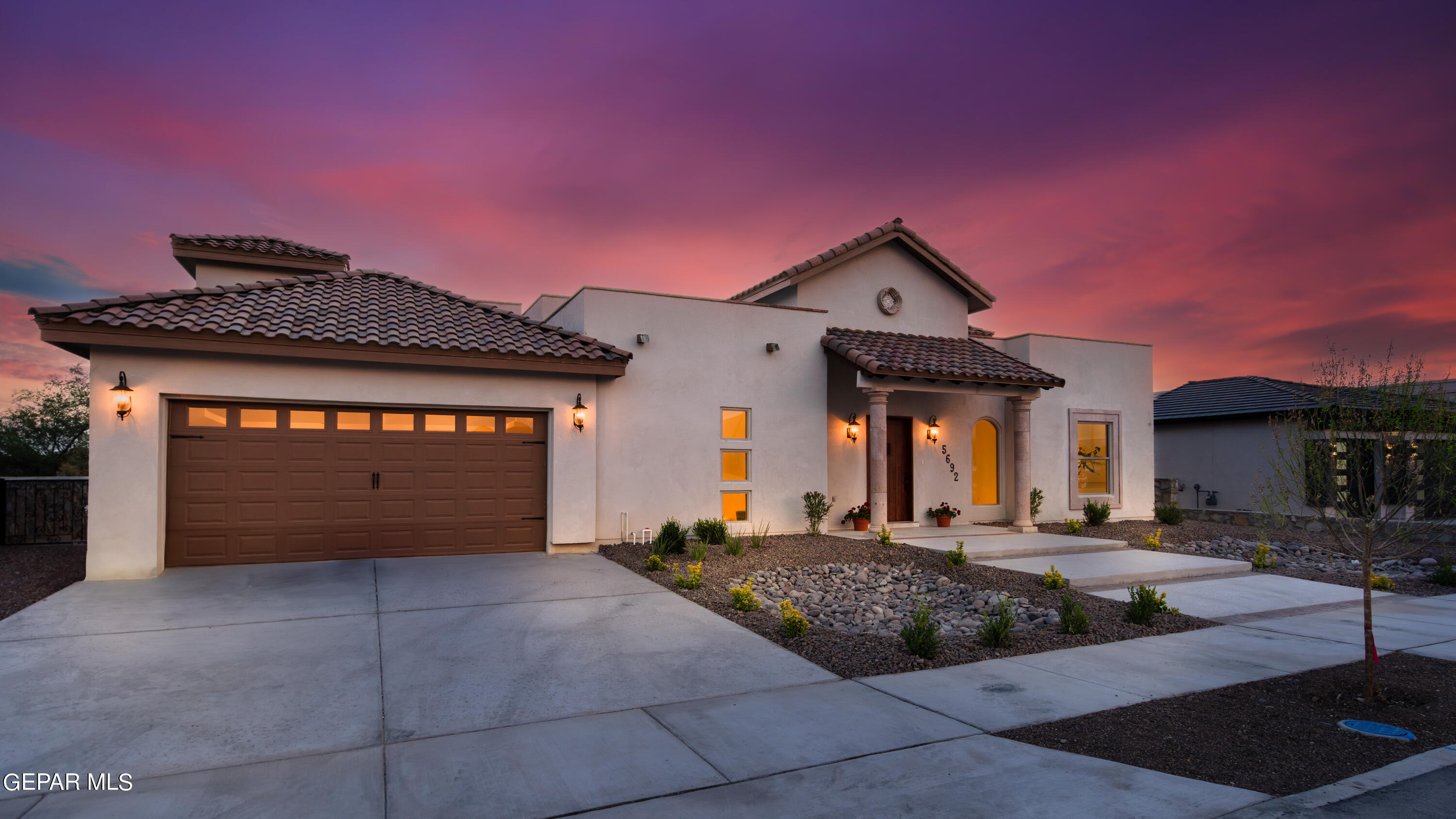 5692 Rio Bonito Circle El Paso, TX 79932 - Photo 2 of 46 a front view of a house with a yard