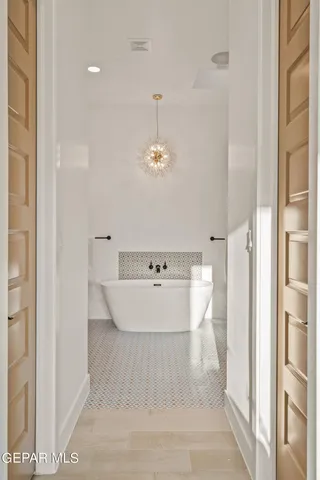 a view of a bathroom with a bathtub