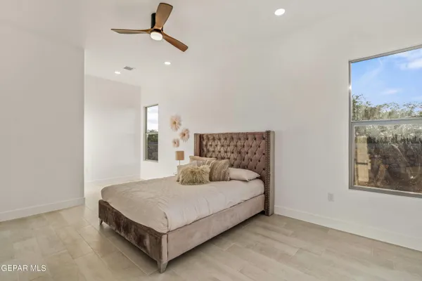 a living room with a bed furniture and a window