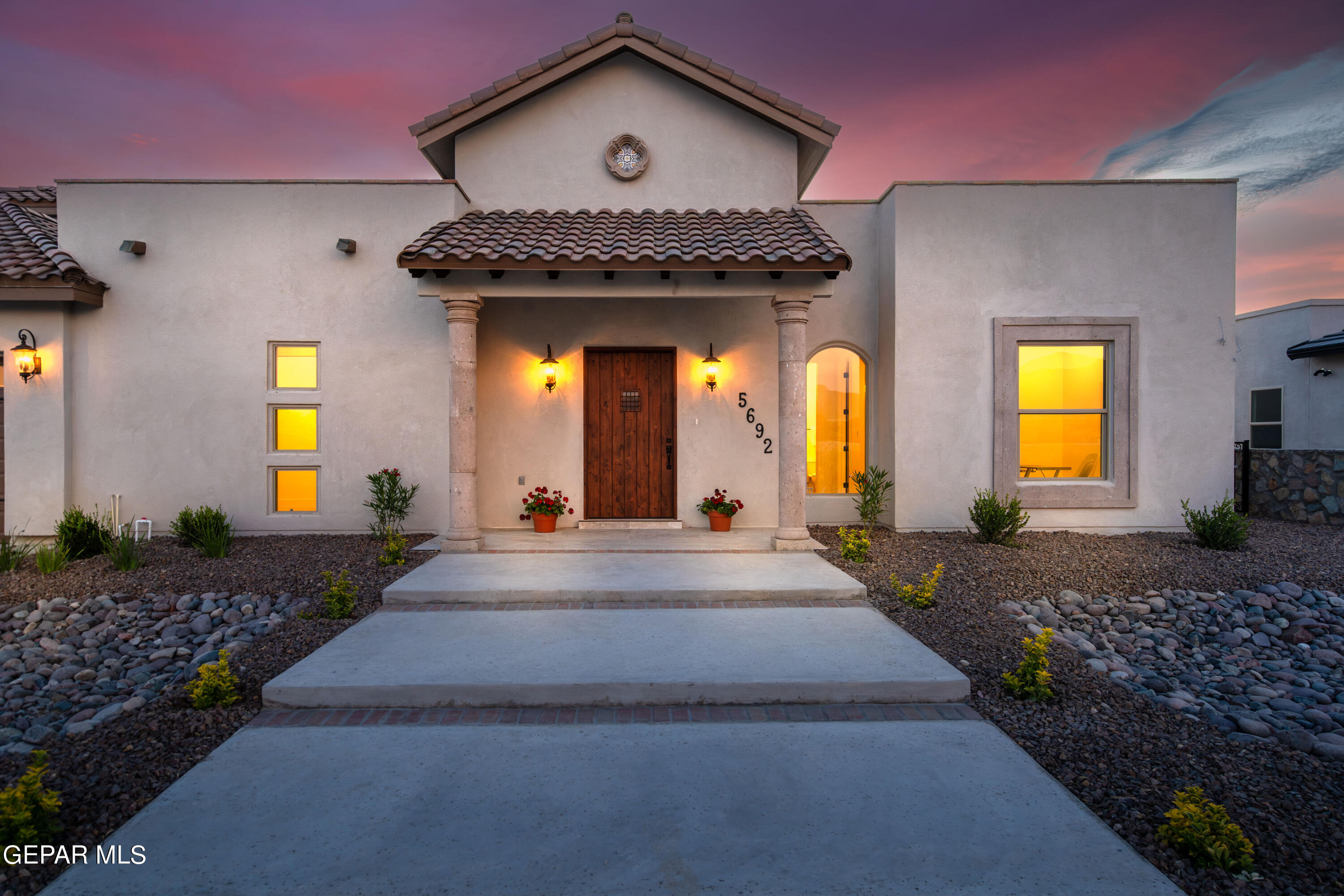 5692 Rio Bonito Circle El Paso, TX 79932 - Photo 3 of 46 a view of a brick house with large windows