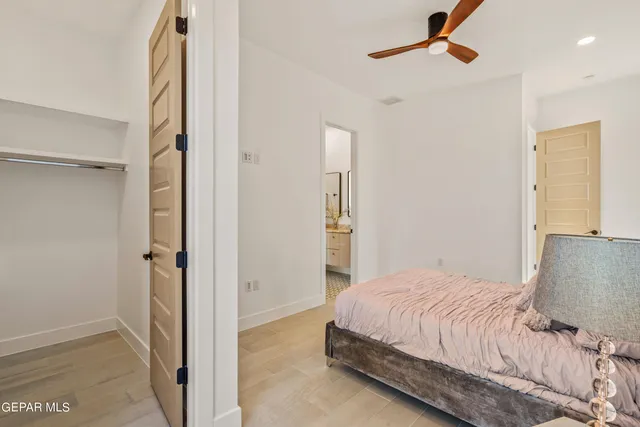 a bedroom with a bed and a walk in closet