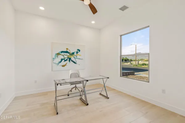 a workspace with furniture and window
