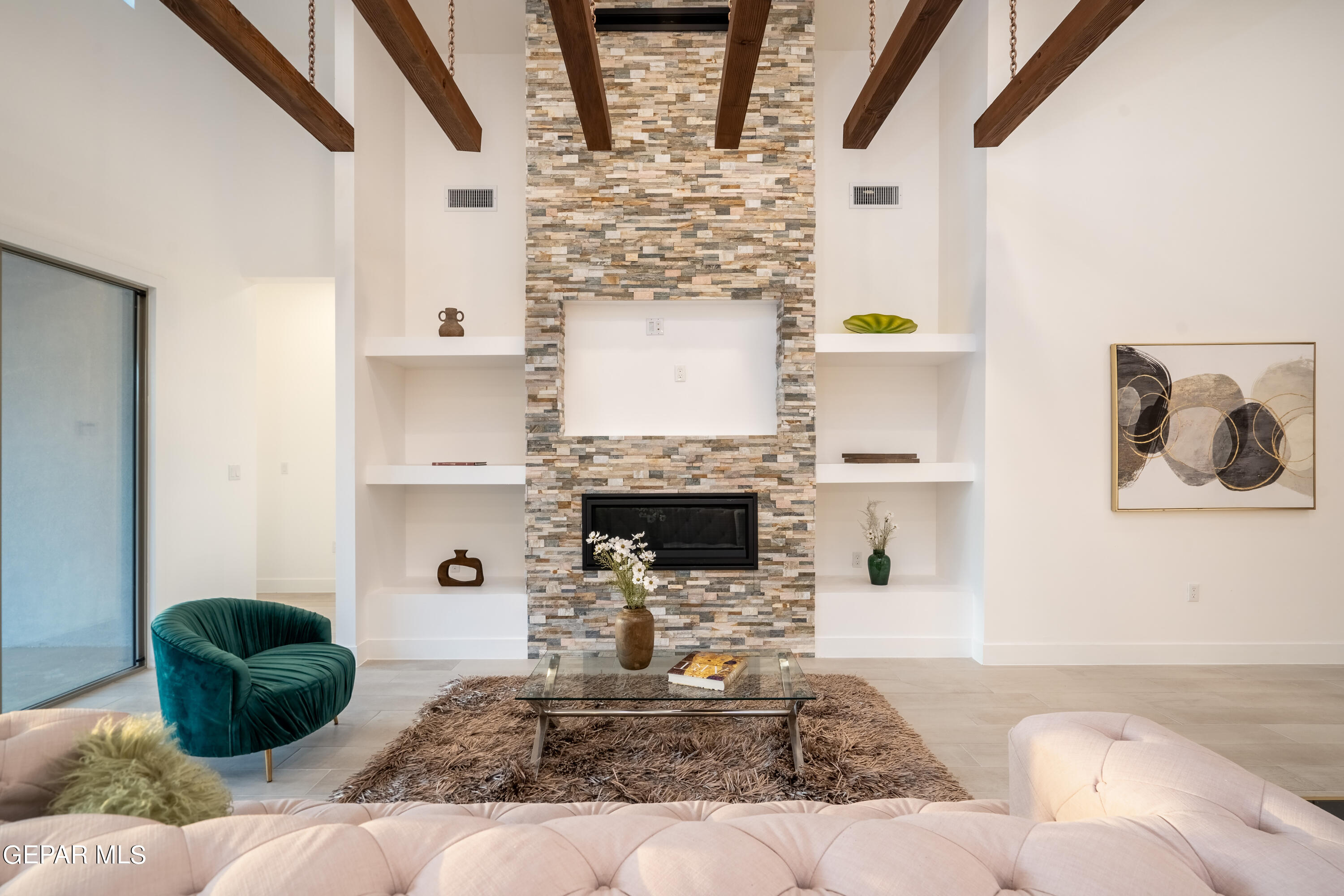 5692 Rio Bonito Circle El Paso, TX 79932 - Photo 6 of 46 a living room with fireplace furniture and decor