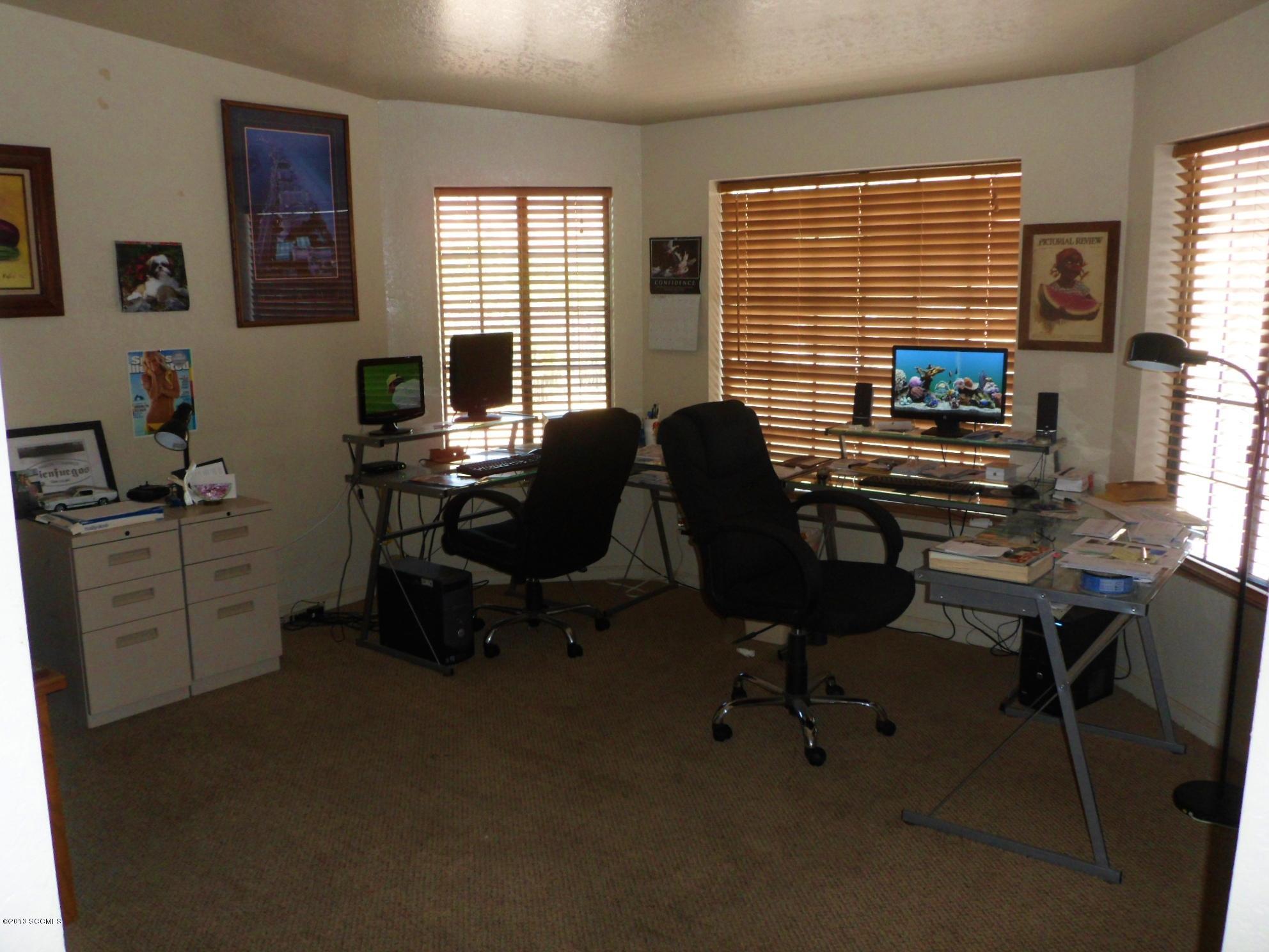 293 Cuenta Court Rio Rico, AZ 85648 - Photo 17 of 25 a view of a workspace with furniture and a window