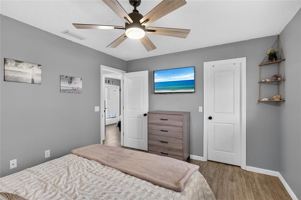 5807 Garfield Road Venice, FL 34293 - Photo 24 of 40 a bedroom with a bed and a dresser