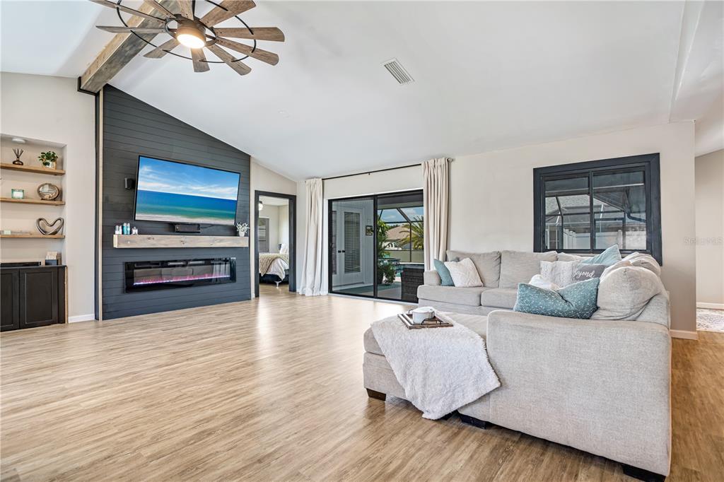 5807 Garfield Road Venice, FL 34293 - Photo 6 of 40 a living room with furniture and a flat screen tv