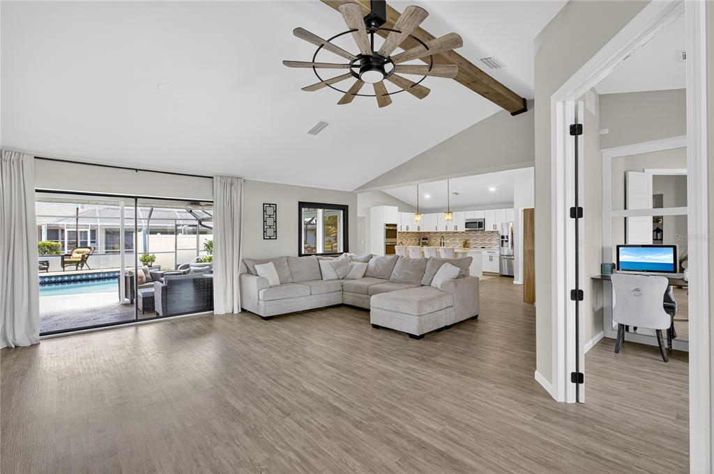 5807 Garfield Road Venice, FL 34293 - Photo 8 of 40 a living room with furniture and a wooden floor