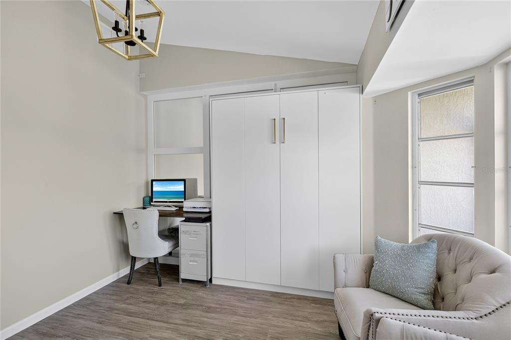 5807 Garfield Road Venice, FL 34293 - Photo 9 of 40 a living room with furniture and a wooden floor