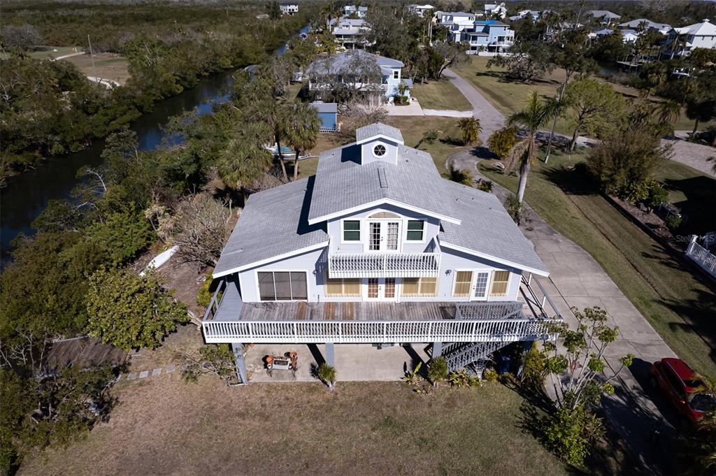 145 Burns Road Terra Ceia, FL 34250 - Photo 34 of 65 an aerial view of a house with yard and lake view