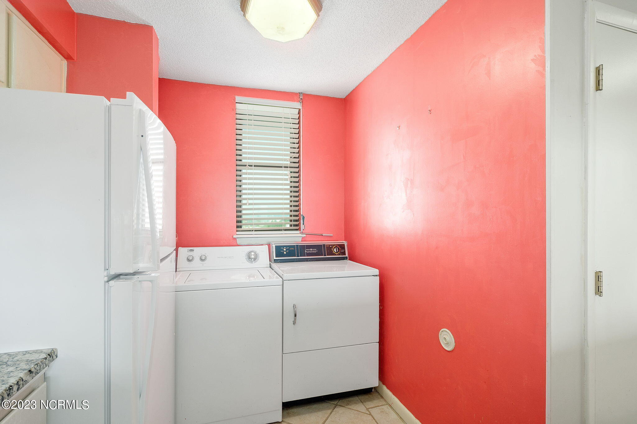 1505 Salter Path Road, Unit 303 Indian Beach, NC 28512 - Photo 22 of 34 Laundry area in kitchen