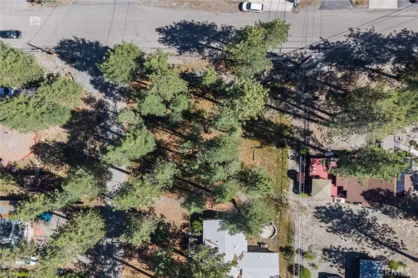 an aerial view of a houses with yard