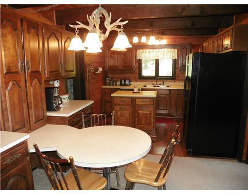 216 Hellein School Road Acme, PA 15610 - Photo 3 of 18 Kitchen. The built in table, wall of cabinets, and island are just some of the features you will love in this kitchen.