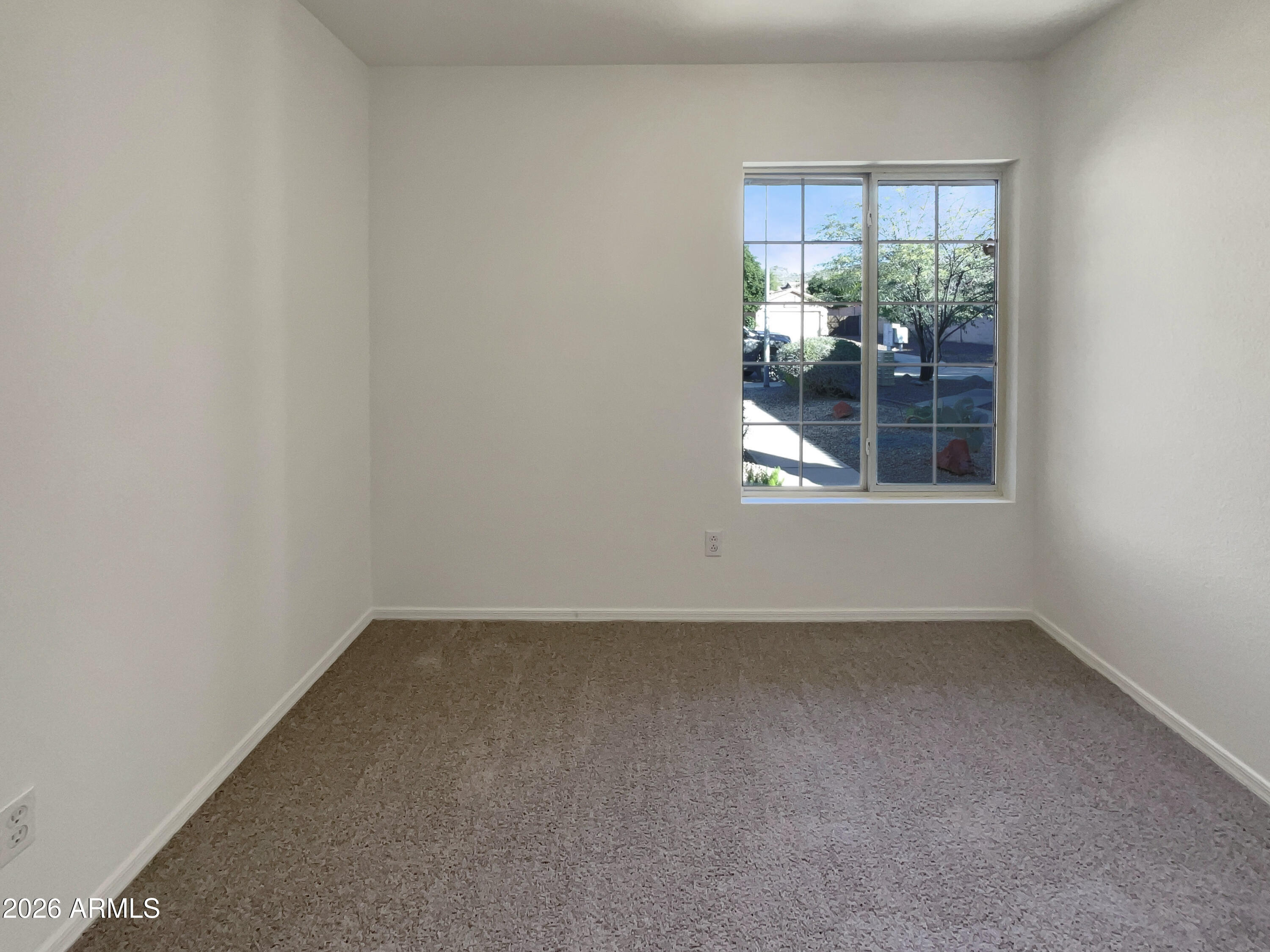 2023 East Wagoner Road Phoenix, AZ 85022 - Photo 11 of 22 an empty room with a window