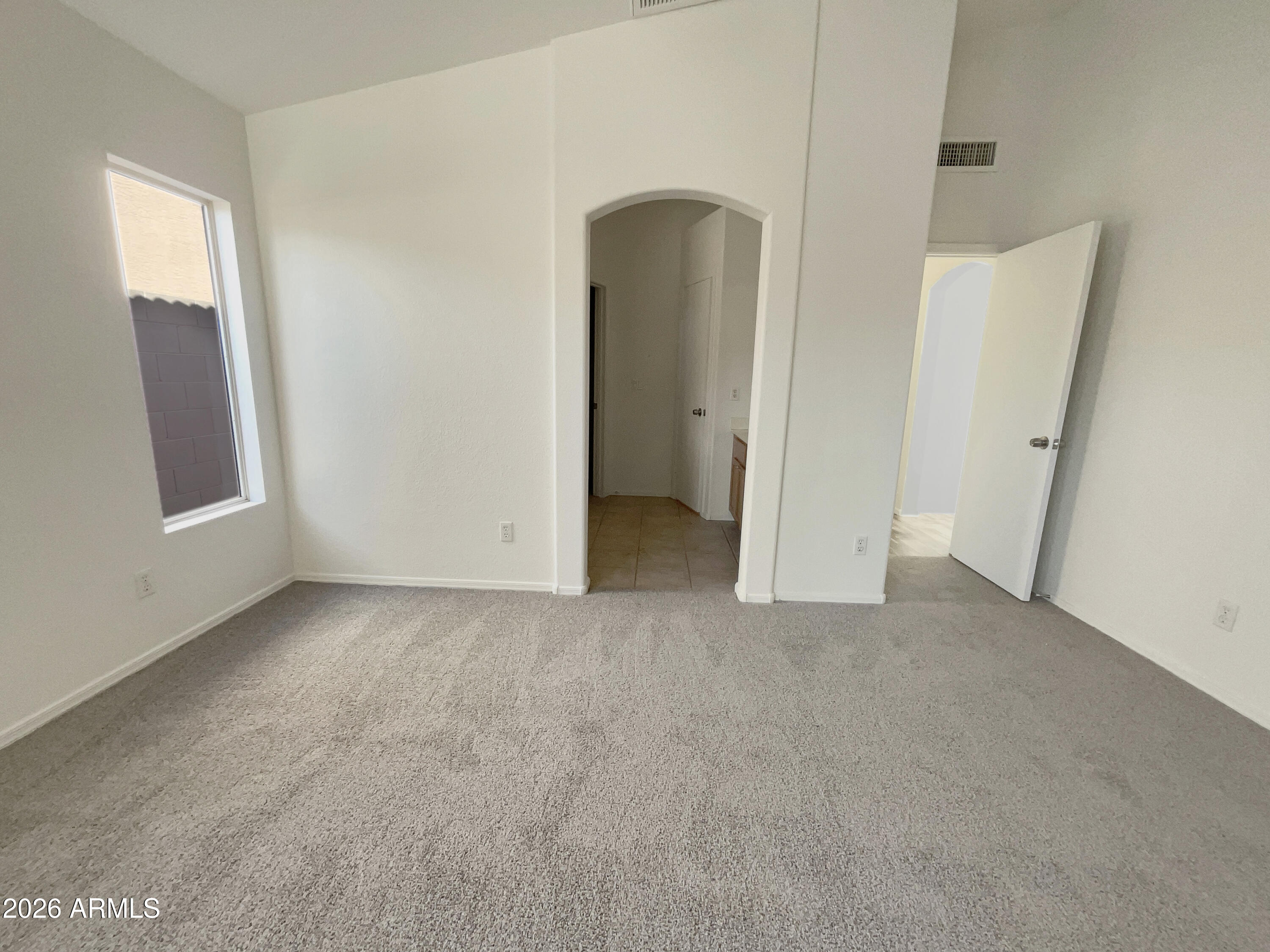 2023 East Wagoner Road Phoenix, AZ 85022 - Photo 14 of 22 an empty room with windows and closet