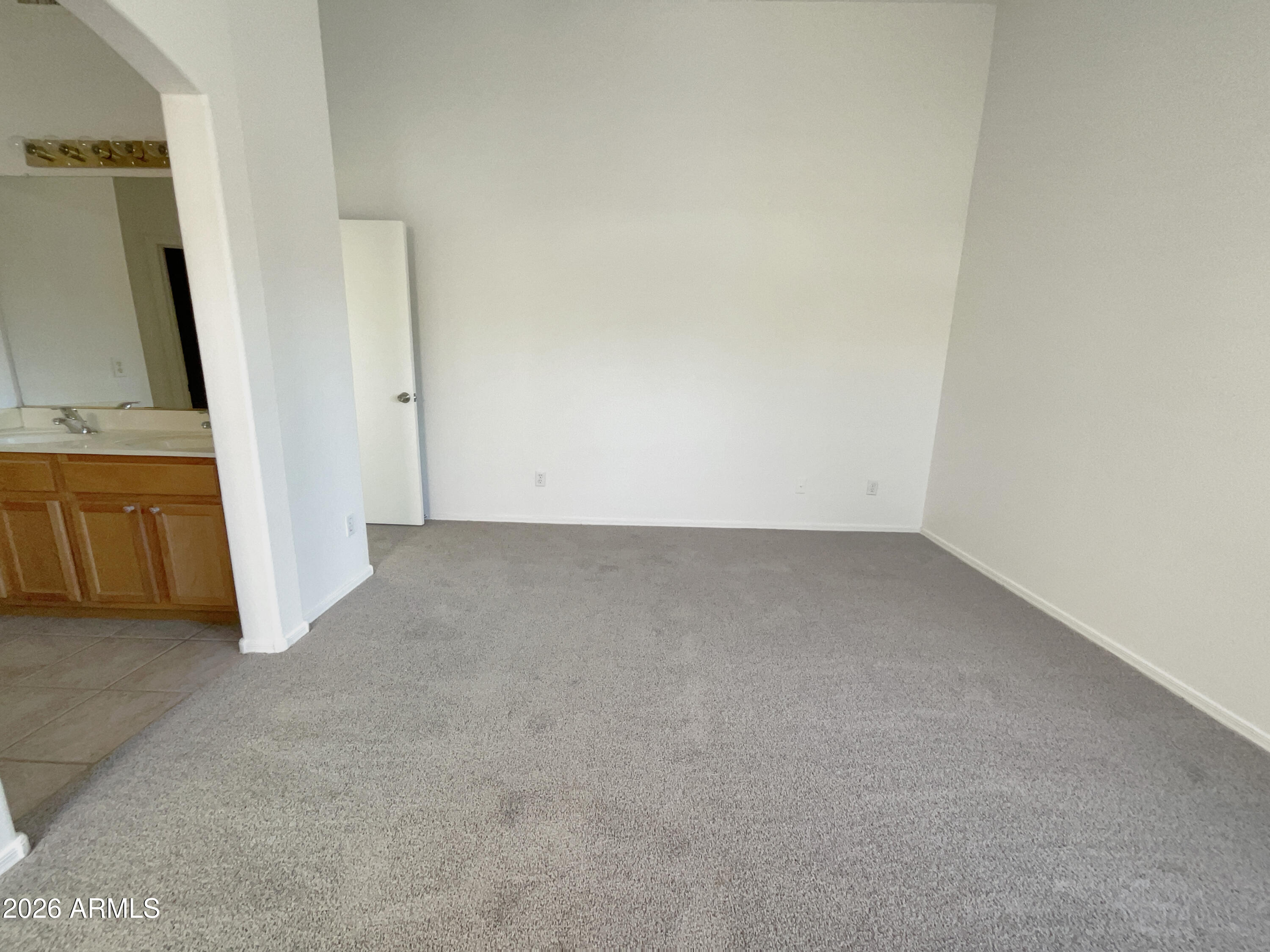 2023 East Wagoner Road Phoenix, AZ 85022 - Photo 15 of 22 a view of a room with wooden floor and a bathroom