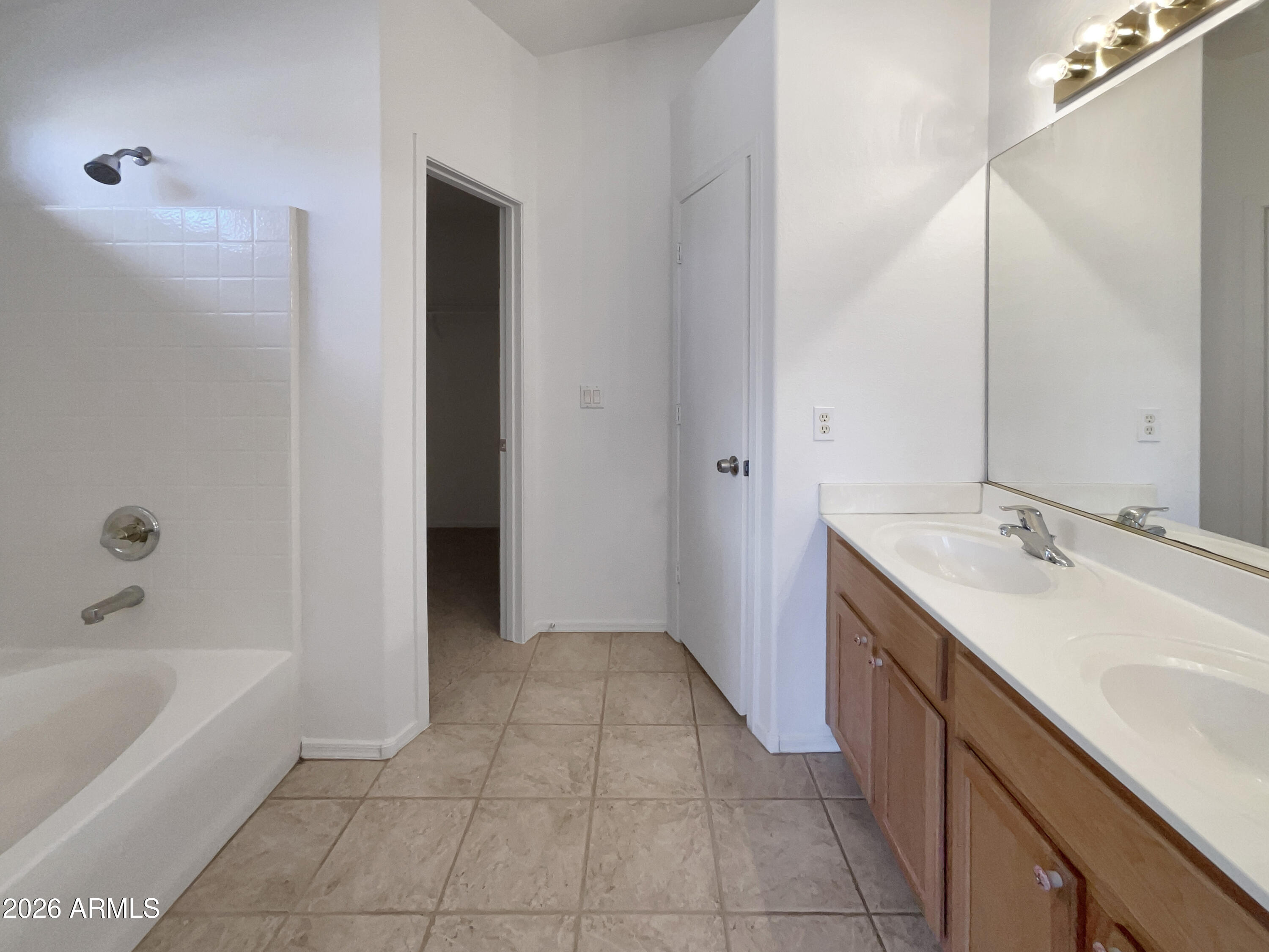 2023 East Wagoner Road Phoenix, AZ 85022 - Photo 17 of 22 a bathroom with a tub sink and mirror