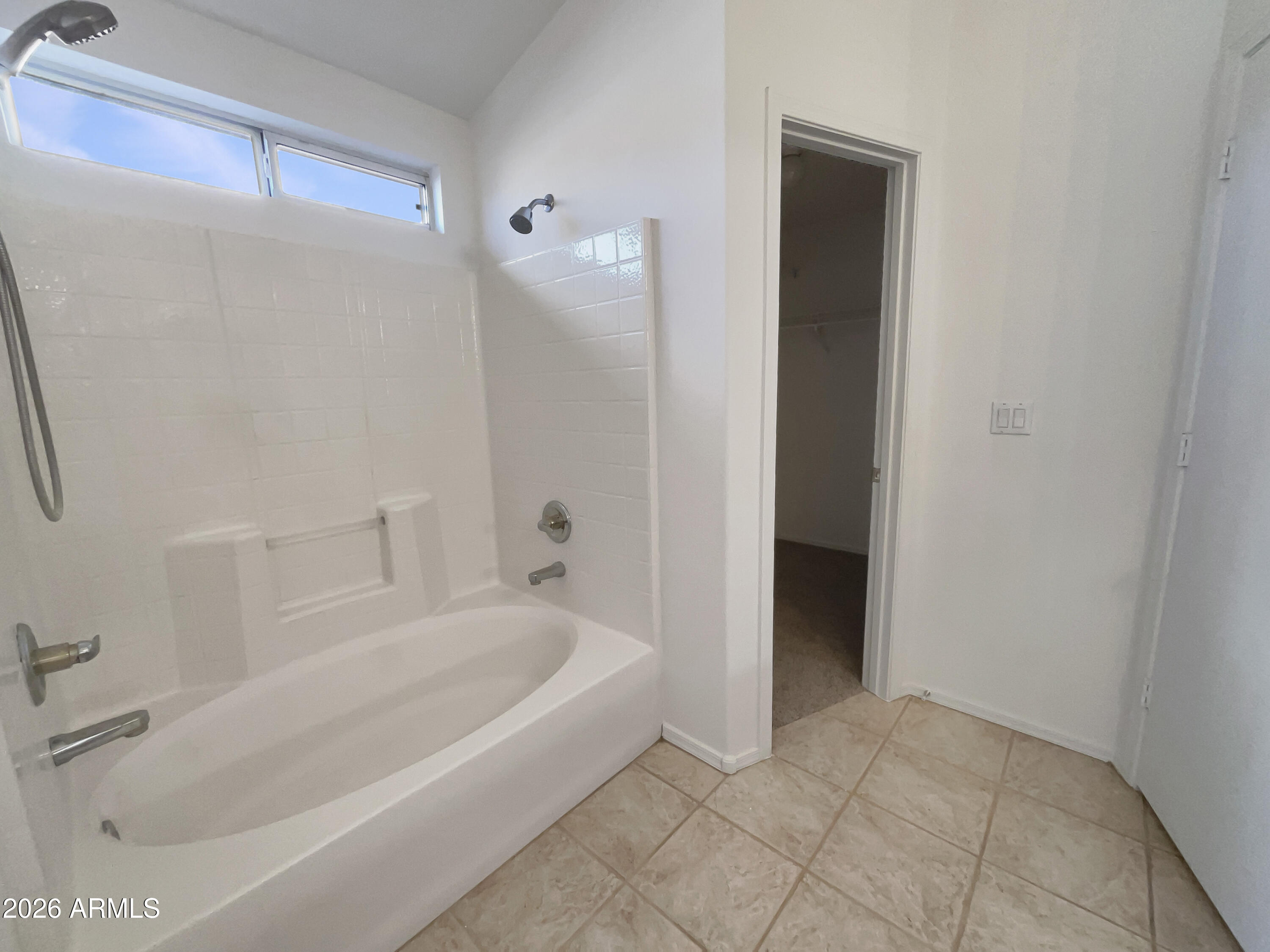2023 East Wagoner Road Phoenix, AZ 85022 - Photo 18 of 22 a bathroom with a bathtub and shower