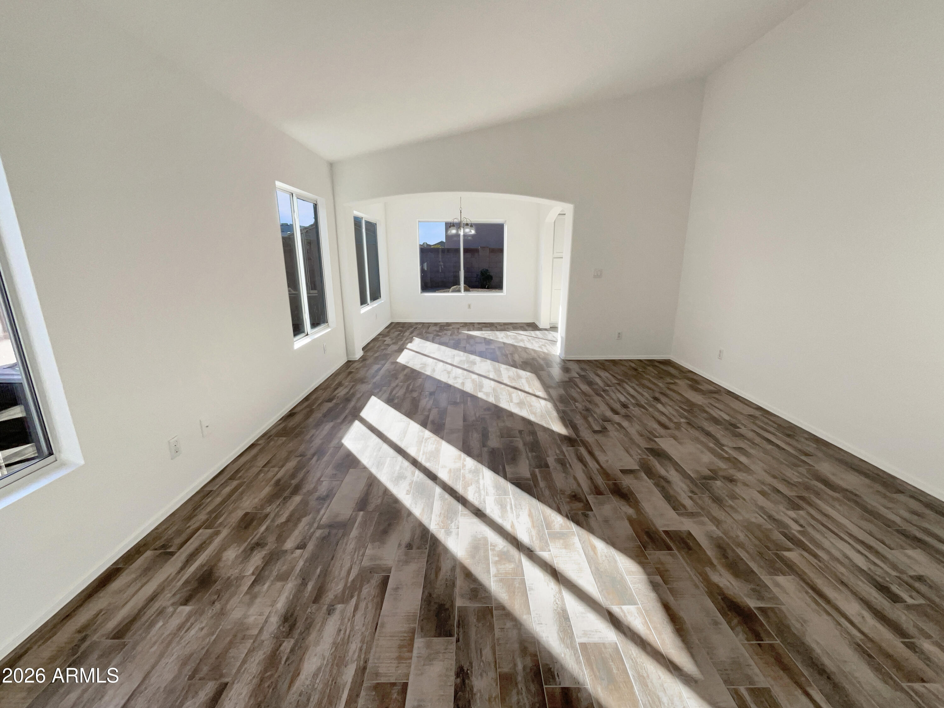 2023 East Wagoner Road Phoenix, AZ 85022 - Photo 3 of 22 a bedroom with a bed and cabinets