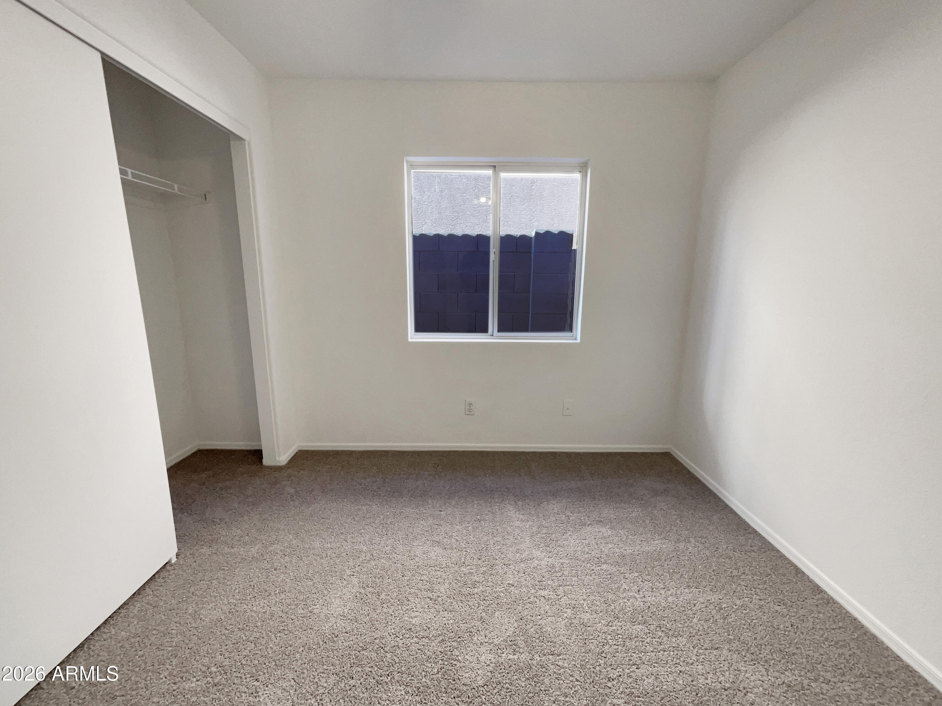 2023 East Wagoner Road Phoenix, AZ 85022 - Photo 9 of 22 an empty room with windows