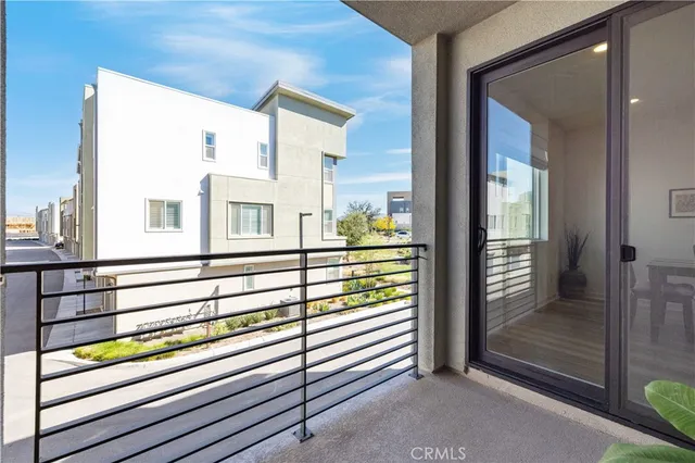 a bathroom with a sink mirror toilet and a window
