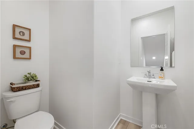 a bathroom with a double vanity sink mirror and shower