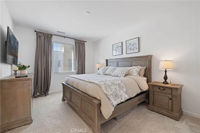 a bathroom with double sink and a mirror